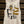 White tank top with a graphic design of a woman in a cowboy hat and boots, holding a gun, with text 'Bang! Bang! Cowboy' on a wooden background.