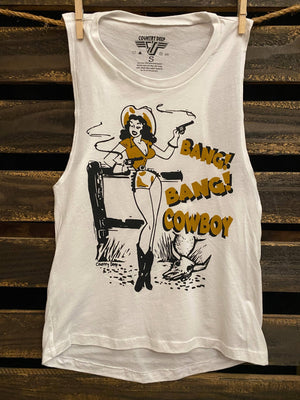 White tank top with a graphic design of a woman in a cowboy hat and boots, holding a gun, with text 'Bang! Bang! Cowboy' on a wooden background.