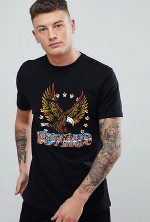 Man wearing a black t-shirt with an eagle graphic and text on a plain background