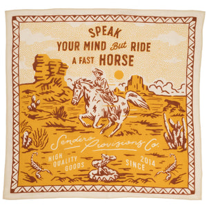 Decorative blanket with a horse and rider design and text 'Speak Your Mind But Ride A Fast Horse' on a beige background.