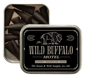 Tin of black sticks with 'Wild Buffalo Motel' label on a white background