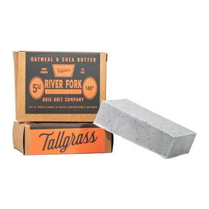 Bar of soap with Tallgrass packaging on a white background