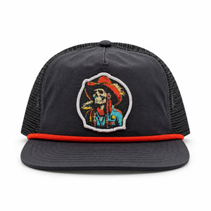 A black hat with a red flat brim and a colorful embroidered patch on the front, shown against a plain white background.