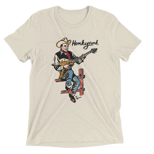 Beige t-shirt with a graphic of a cowboy playing guitar and the text 'Honkytonk' on a white background.