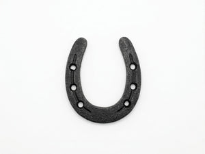 Black horseshoe on a white background
