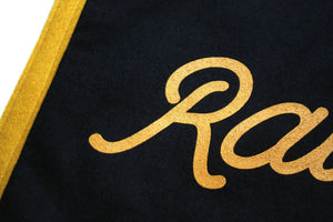 A rectangular black flag with the phrase 'Raise Hell, Kid' screen-printed in gold lettering, with gold details along the edges.