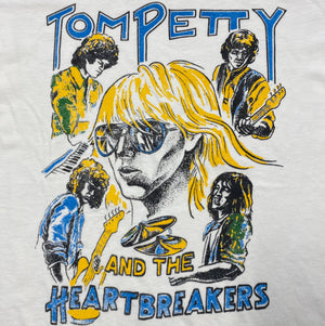 Graphic of Tom Petty and the Heartbreakers with stylized illustrations on a light gray background