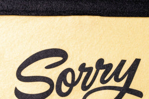 A rectangular camp flag with a cream body and the text 'Sorry NO BOOT NO SCOOT NO BOOGIE' printed in red, black, and gold colors.