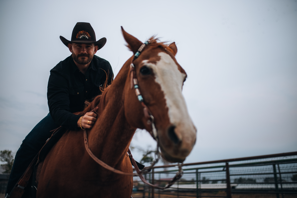 Ewing 23 Western Hat and a Cowboy on a Horse.