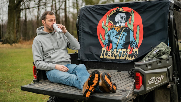 Male model wearing ramble hoodie on a Ranger 4x4 ATV.